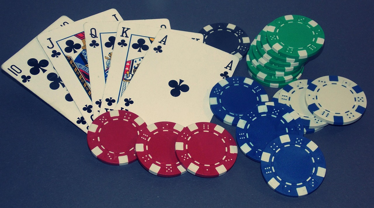 Poker table with a Joker card and casino chips